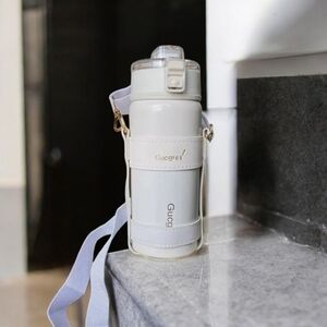 NEW stainless steel drinking bottle with holder and lanyard in white